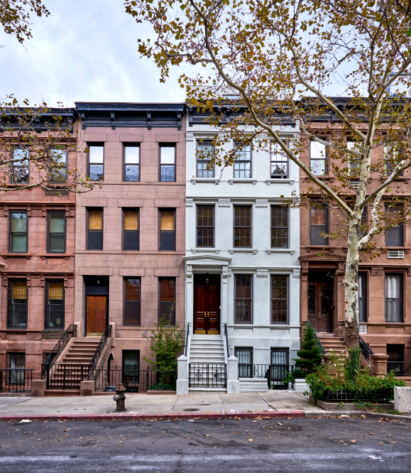 Classic New York brownstones, symbolizing Seward & Seward’s local expertise in property transactions and cooperative law.