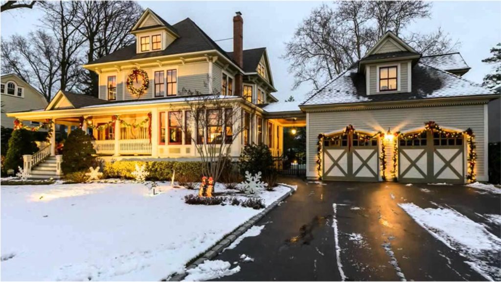 Victorian-style home with festive holiday lights and wreaths, representing Seward & Seward’s experience handling residential real estate transactions year-round.